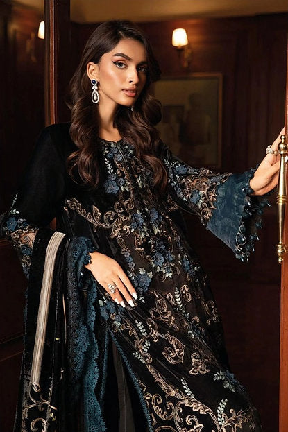 Woman wearing a black and teal embroidered pakistani suit with 3D floral detailing and matching dupatta – ideal for  receptions, festive wear in UAE from Meraki Vastram.