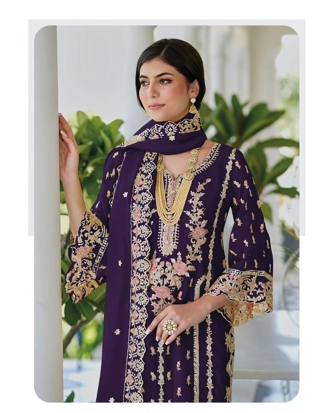 Woman wearing a deep plum embroidered straight-cut suit with floral detailing and matching dupatta, ideal for Diwali, weddings, and festive wear – Meraki Vastram UAE ethnic collection.
