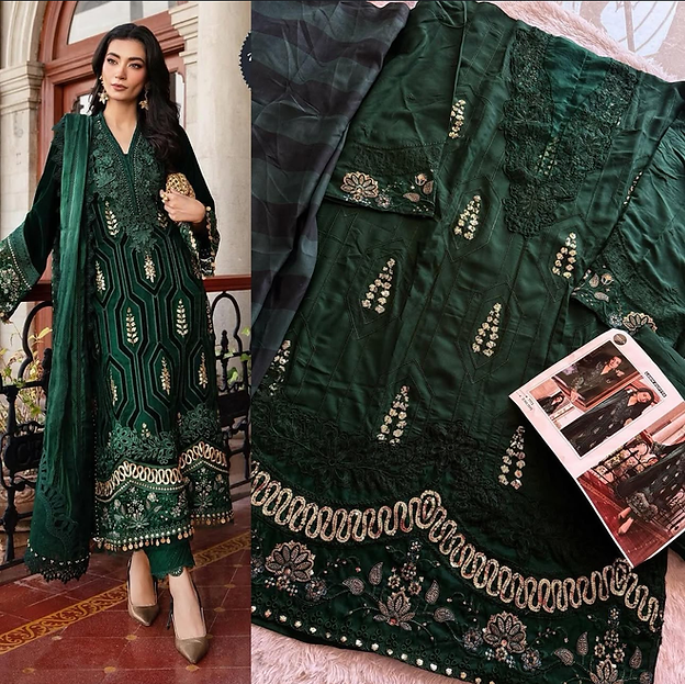 Woman wearing emerald green embroidered suit with velvet dupatta and intricate zari work – perfect ethnic wear for weddings, Diwali, Eid & Karwachauth in UAE from Meraki Vastram.
