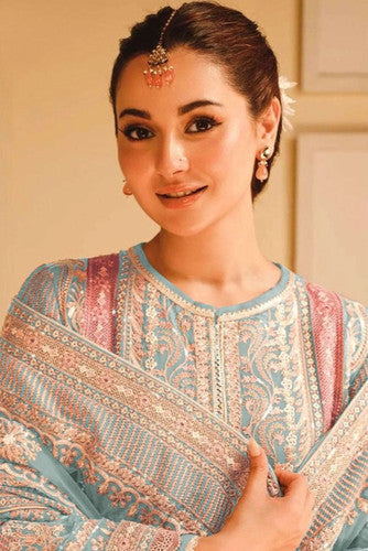 Woman wearing a powder blue pastel pakistani pret embroidered suit set with straight pants and dupatta – perfect for Eid, Rakhi, and festive daywear in UAE by Meraki Vastram.