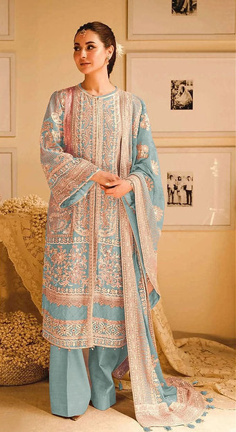 Woman wearing a powder blue pastel pakistani pret embroidered suit set with straight pants and dupatta – perfect for Eid, Rakhi, and festive daywear in UAE by Meraki Vastram.