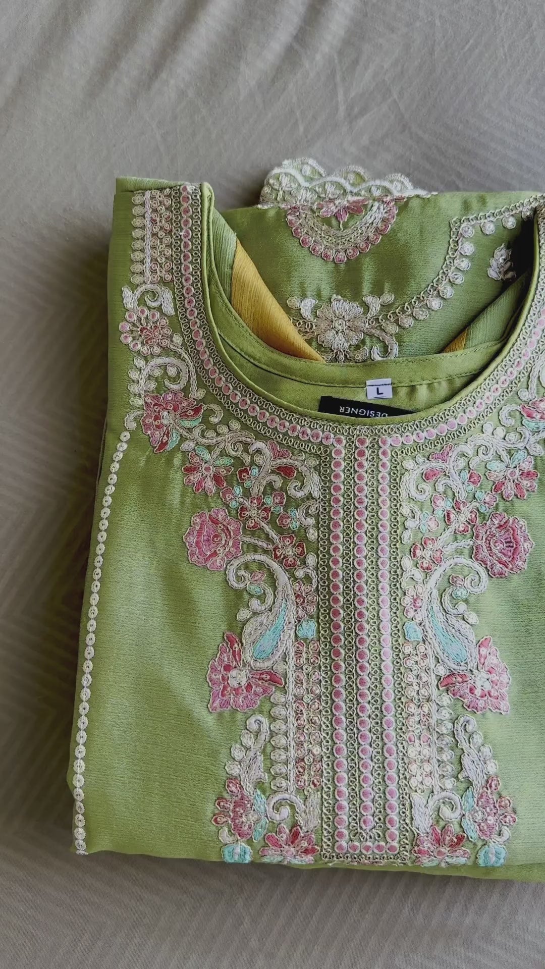 Woman wearing an olive green embroidered palazzo pakistani suit with mustard yellow dupatta – perfect festive outfit for Rakhi, Diwali, Teej, and haldi functions in UAE by Meraki Vastram.